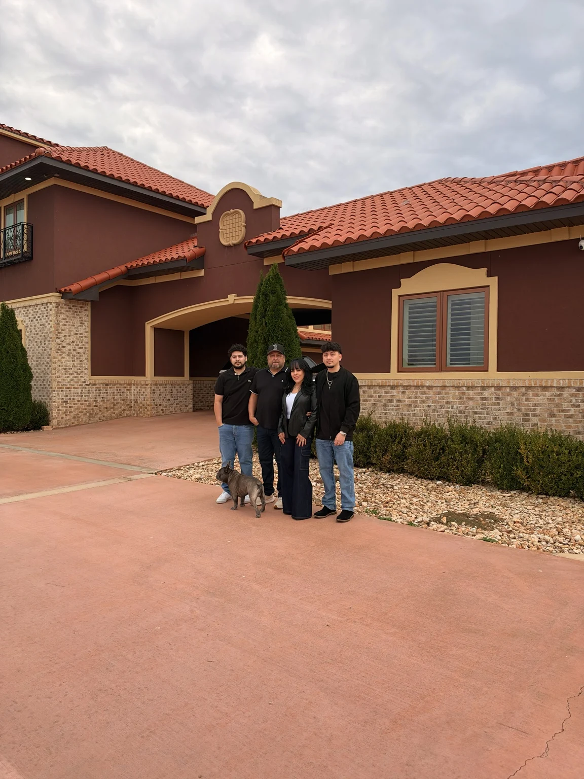 The King Burrito family outside with their dog