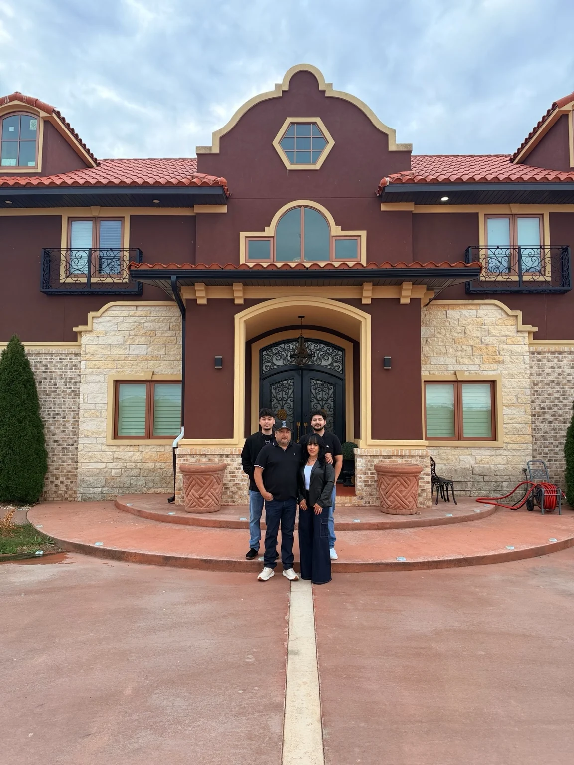 The King Burrito family in front of their home